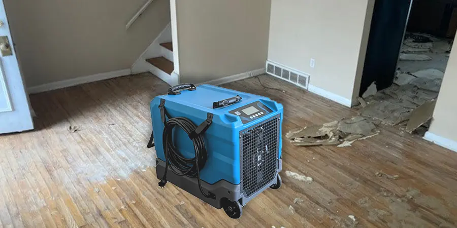 LGR dehumidifier drying a stripped wood subfloor in a Lewisville home