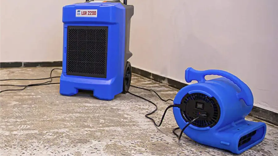 LGR dehumidifier and an air mover drying a room after carpet removal
